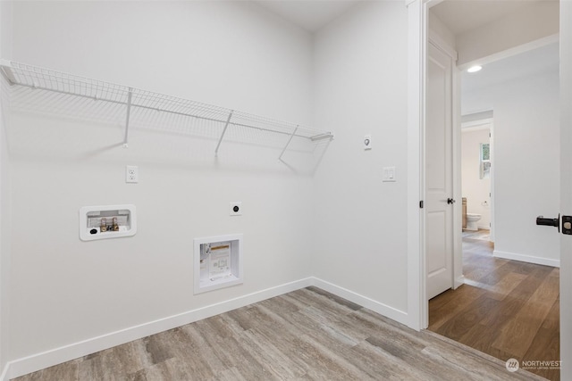 washroom featuring hookup for an electric dryer, hardwood / wood-style floors, and washer hookup