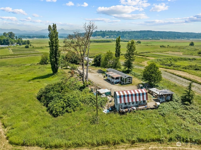 drone / aerial view featuring a mountain view and a rural view