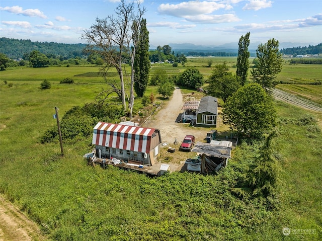 birds eye view of property with a rural view