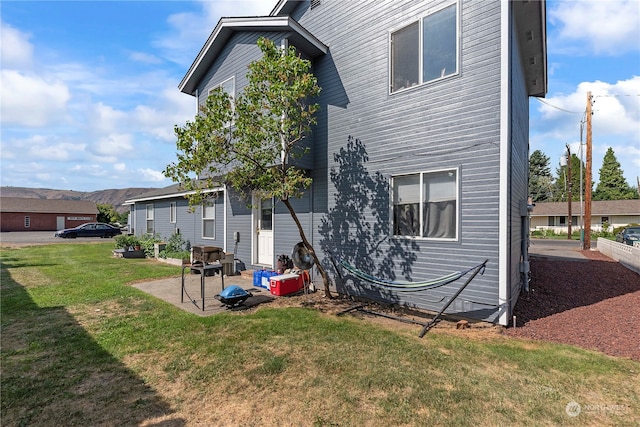 59 N Iowa Ave, East Wenatchee, WA 98802 - back of property featuring a patio area and a yard