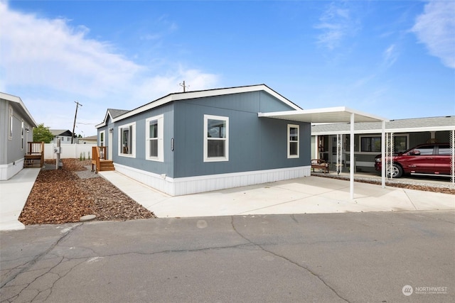 1256 Jones Dr, Walla Walla, WA 99362 - manufactured / mobile home featuring driveway and a carport