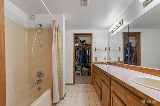 bathroom with shower / tub combo, tile floors, and dual bowl vanity