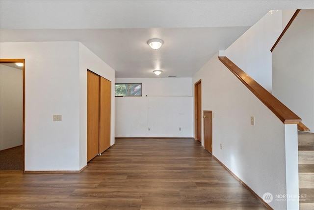 corridor with dark wood-type flooring