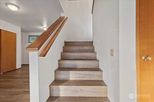 stairway featuring dark hardwood / wood-style flooring