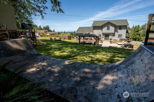 view of yard featuring a playground and a gazebo