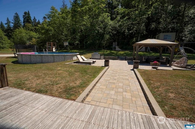 surrounding community with a gazebo, a yard, and a patio area