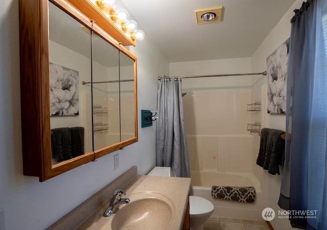 full bathroom with large vanity, tile floors, toilet, and shower / tub combo with curtain