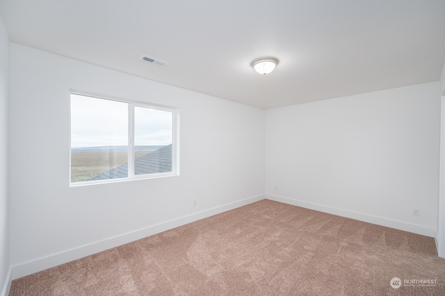 empty room featuring light colored carpet