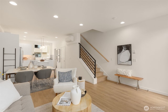 8326C SB-3 13th Ave NW, Seattle, WA 98117 - living area with an AC wall unit, stairs, light wood-style floors, recessed lighting, and baseboards