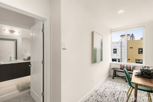 8326C SB-3 13th Ave NW, Seattle, WA 98117 - hallway with a sink, baseboards, recessed lighting, and light colored carpet