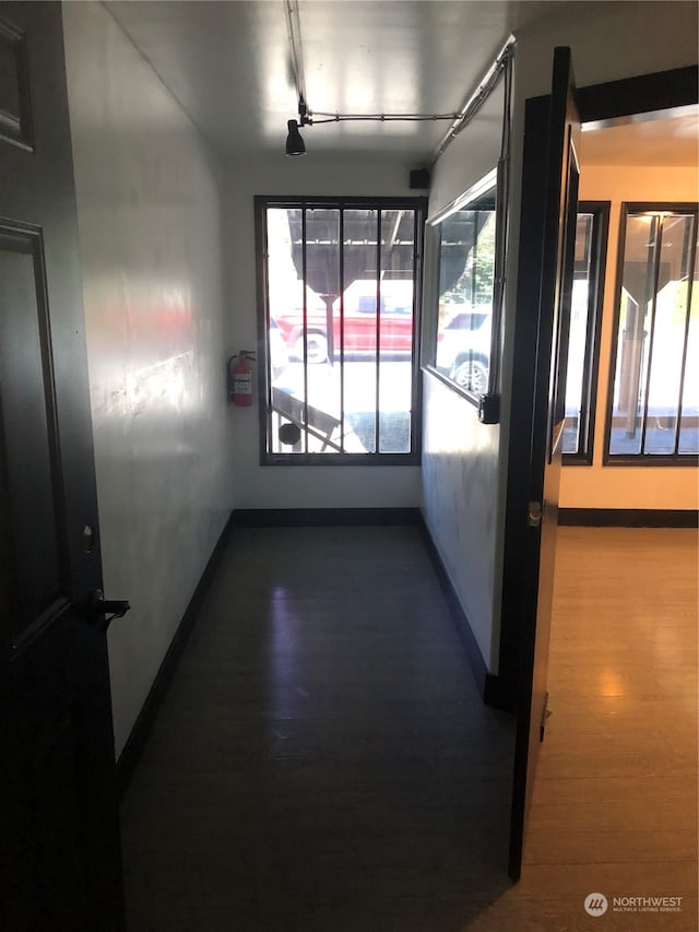 interior space with dark hardwood / wood-style flooring