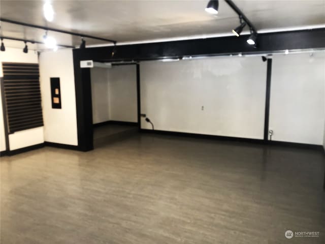 basement with light hardwood / wood-style flooring