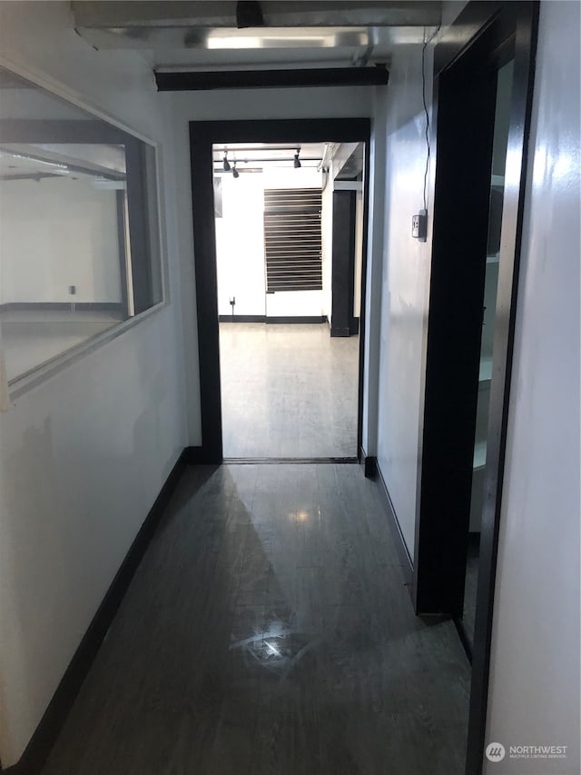 hallway featuring dark hardwood / wood-style flooring