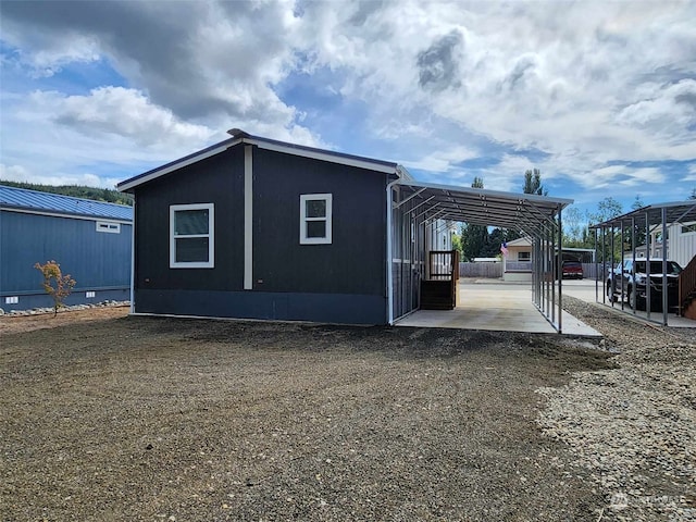 view of home's exterior featuring a detached carport