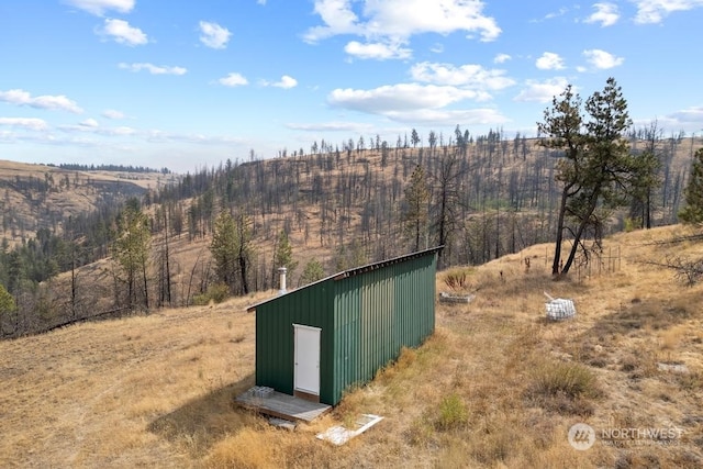 view of outbuilding featuring a rural view