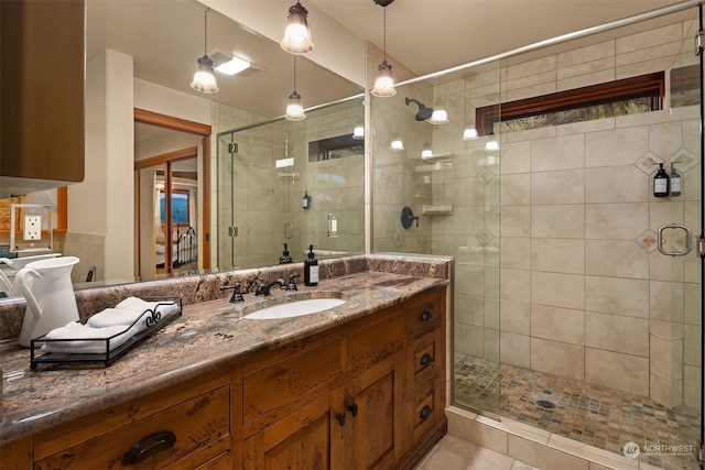 bathroom with vanity, tile floors, and walk in shower