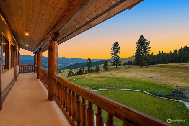 balcony at dusk with a mountain view