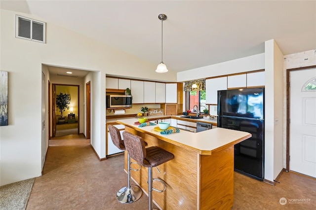 kitchen with stainless steel appliances, hanging light fixtures, white cabinetry, a center island, and sink