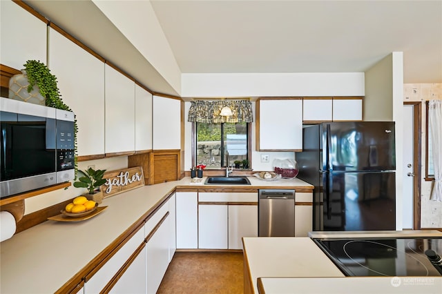 kitchen featuring white cabinets, black appliances, sink, and light tile floors