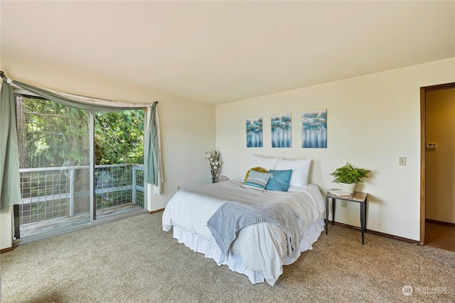 bedroom with access to outside and carpet floors