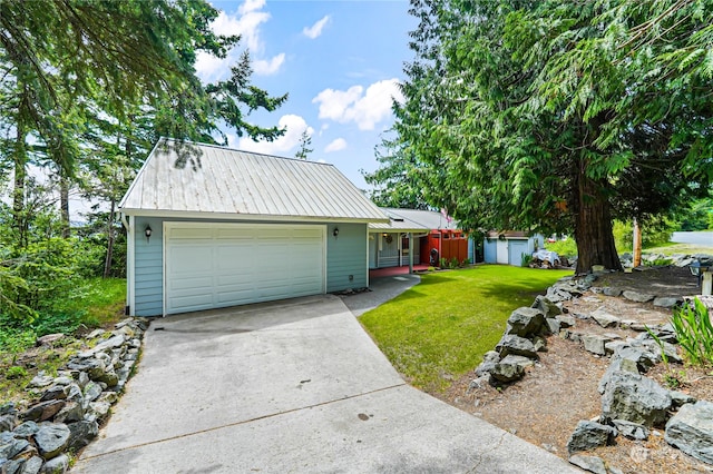 view of front of home with a front lawn and a garage