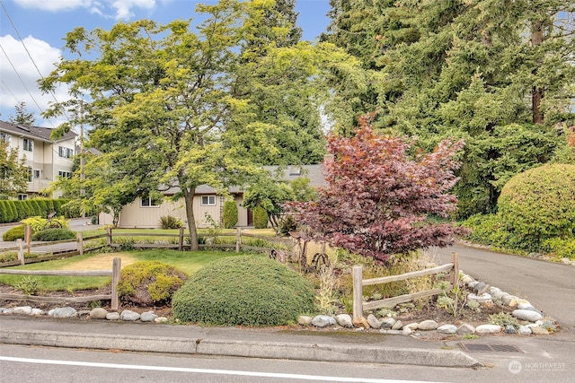 view of property hidden behind natural elements