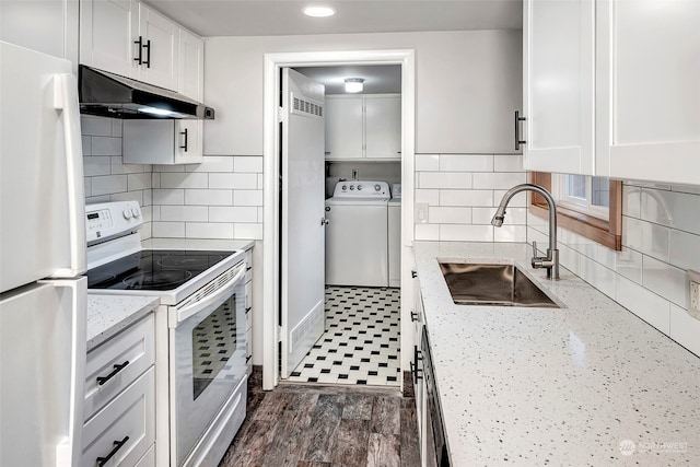 kitchen with tasteful backsplash, white appliances, dark hardwood / wood-style flooring, light stone countertops, and white cabinets