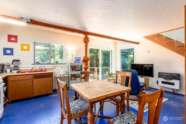 dining room with sink and plenty of natural light