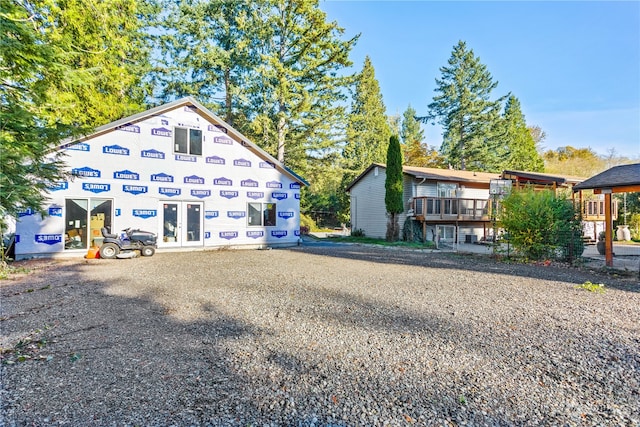 rear view of house featuring french doors