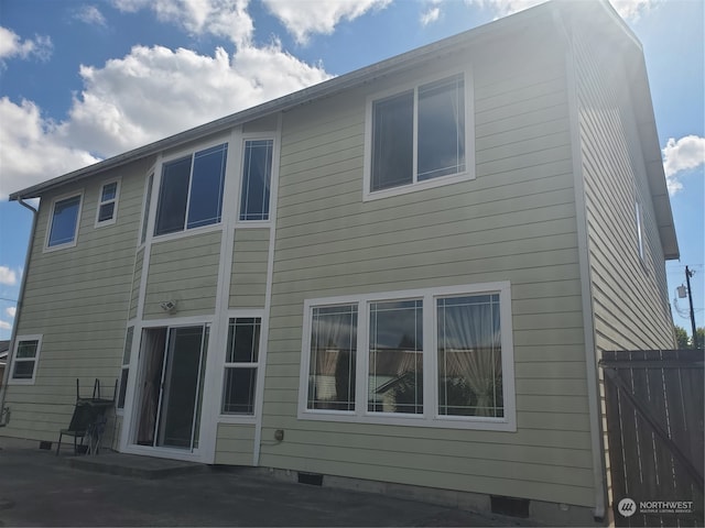 back of property with a patio area