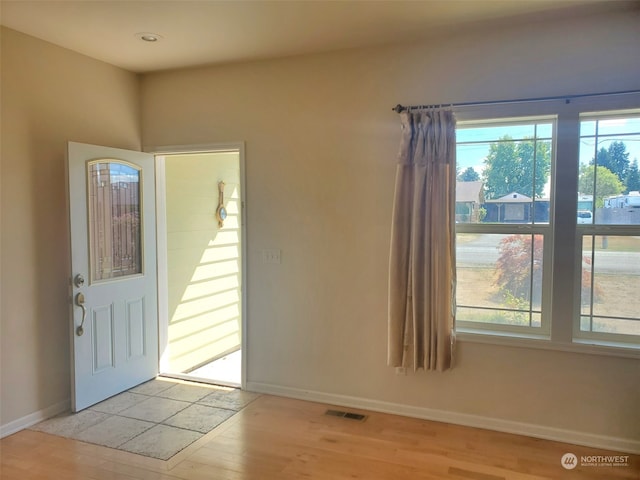 entrance foyer featuring a healthy amount of sunlight and light hardwood / wood-style flooring