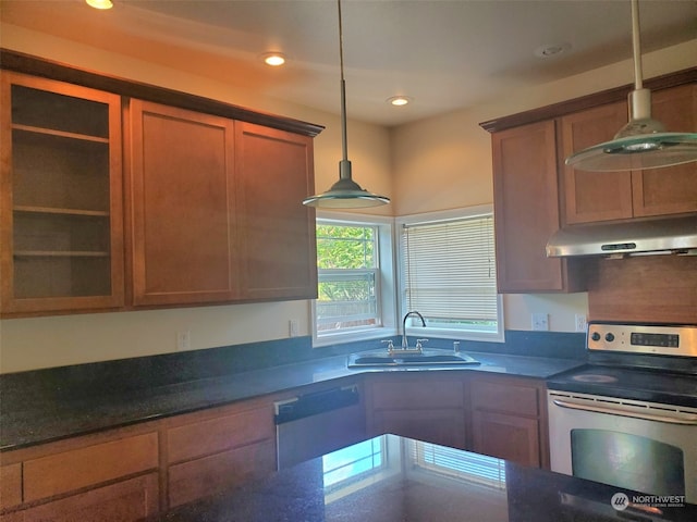 kitchen with decorative light fixtures, stainless steel electric range oven, sink, and white dishwasher