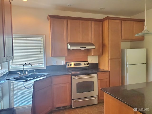 kitchen featuring light tile flooring, hanging light fixtures, white fridge, stainless steel range with electric cooktop, and sink