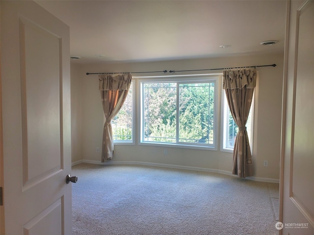 view of carpeted spare room