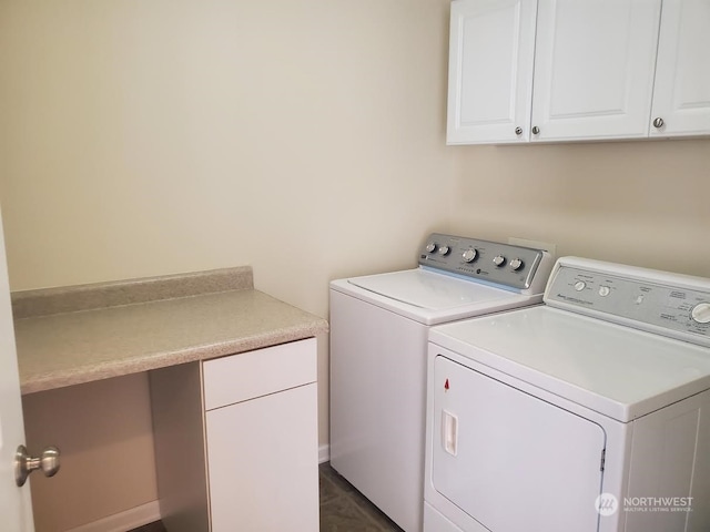 laundry room featuring cabinets and washer and dryer