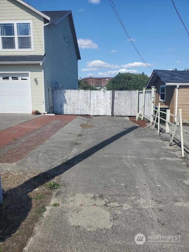 view of side of property with a garage