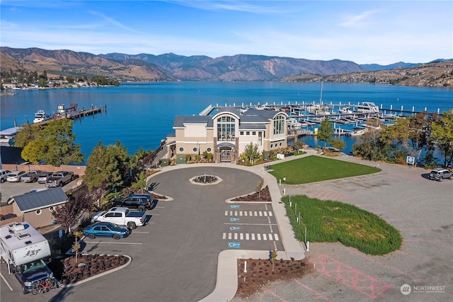 birds eye view of property featuring a water and mountain view