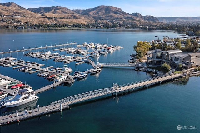 bird's eye view with a water and mountain view