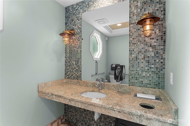 bathroom featuring tile walls and vanity