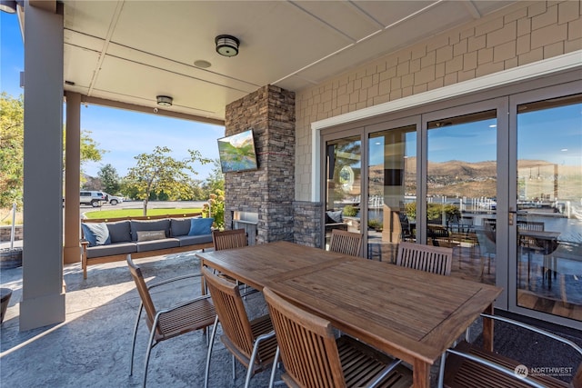 view of patio / terrace with outdoor lounge area and a mountain view