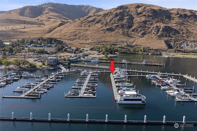 view of water feature featuring a dock and a mountain view