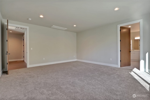 spare room with light colored carpet