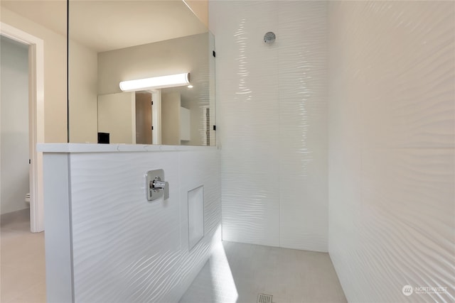 bathroom with toilet and tile flooring