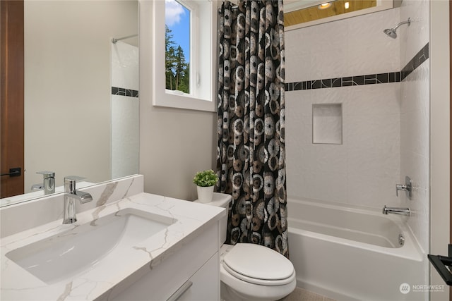 full bathroom with large vanity, toilet, and shower / tub combo with curtain