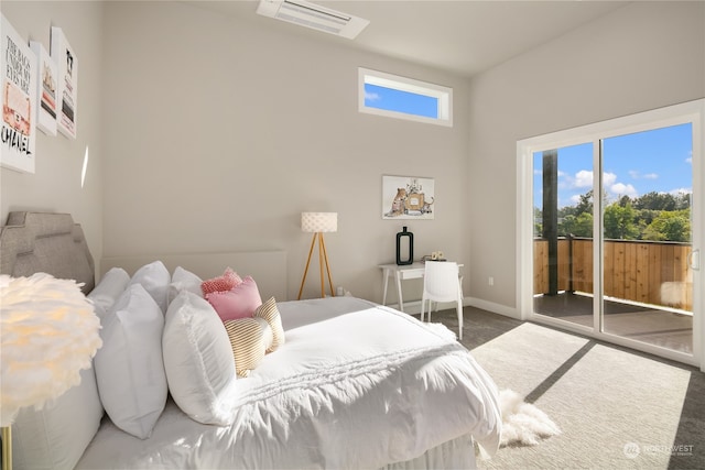 carpeted bedroom featuring access to exterior