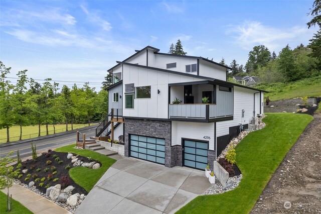 view of front facade with a front yard and a garage