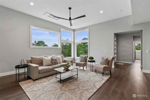 living room featuring dark hardwood / wood-style floors, plenty of natural light, and ceiling fan