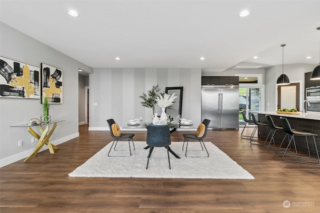 dining area featuring dark wood-type flooring