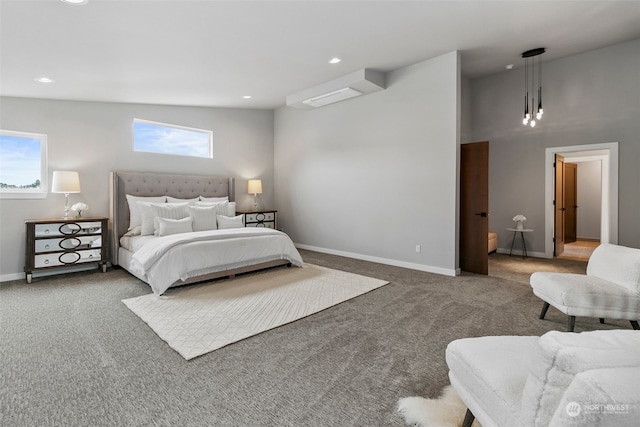 bedroom with multiple windows, carpet, and vaulted ceiling