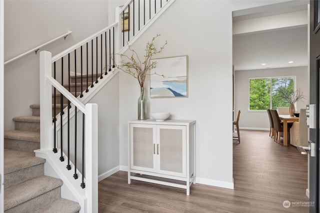 stairway with wood-type flooring